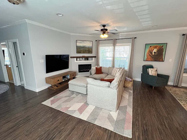 Large open living room with electric fireplace