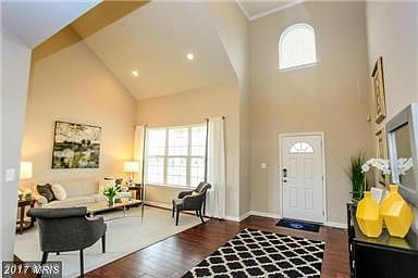 Living Room with Cathedral Ceilings and Hardwood