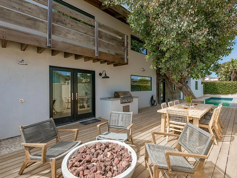Side outdoor deck with pool, firepit and bbq