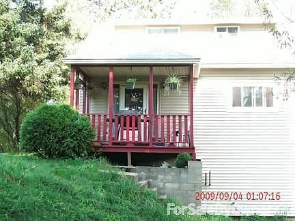 Side of house with covered porch
