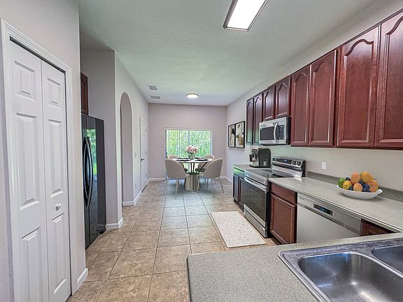 Kitchen and Breakfast Nook with Patio and Conservation Views