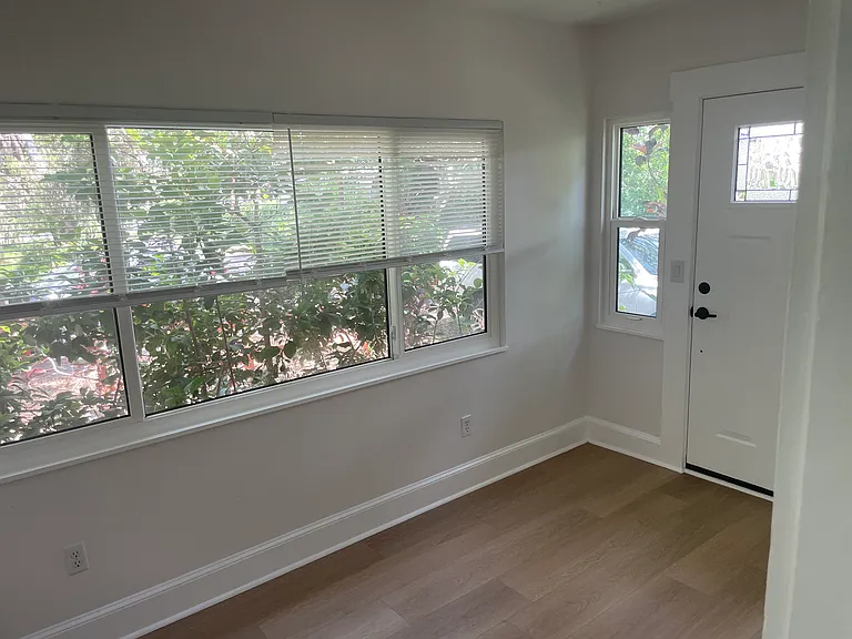 Bonus room view of the windows and inside the front door.