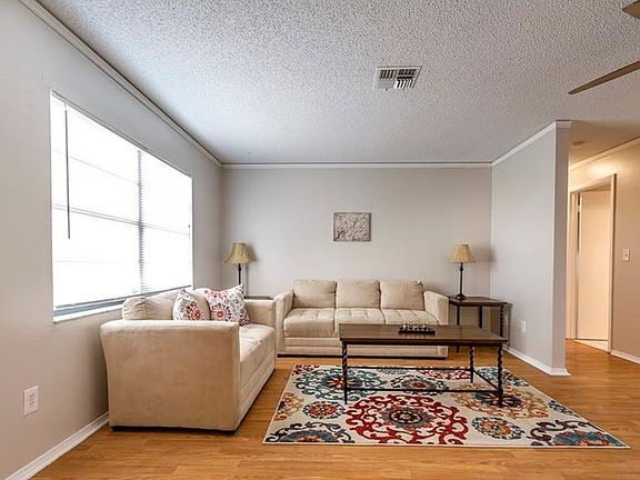 LIVING ROOM WITH NEW PERGO WOOD FLOORS AND PAINT