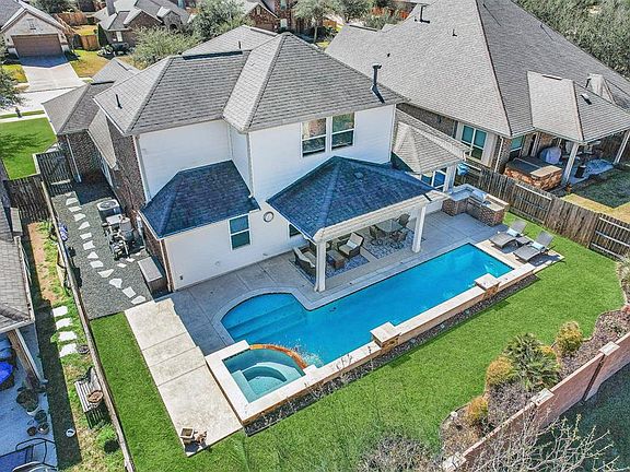 Amazing 1 1/2 story layout with your very own backyard oasis.