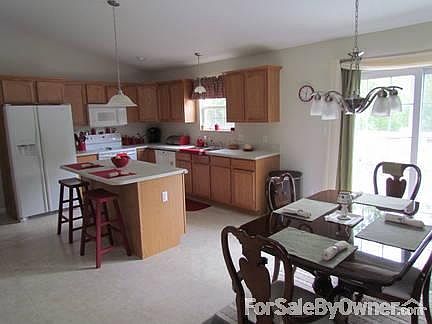 Kitchen and Dining Room Combination
						:
						Kitchen w/island, all wood cabinets. Vaulted ceilings. Perfect for entertaining.