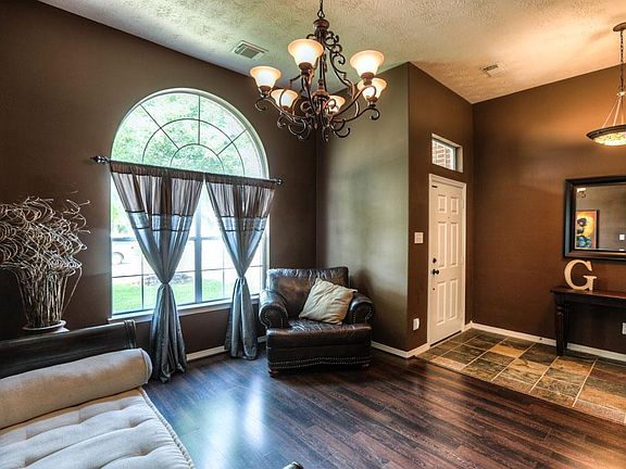Inviting Entry Greets you with Slate Tile and Tiffany Light Fixtures with access to Front Room with 