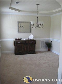 Diningroom with Tray ceiling and upgraded chair rail