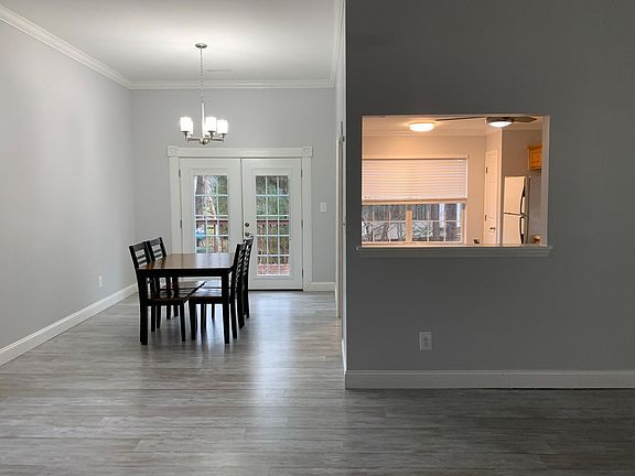 Living into dining, kitchen pass through, French doors leading to back deck
