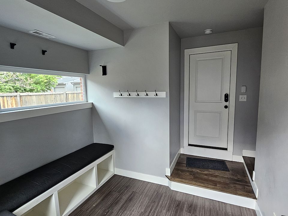 Entry mud room with ski rack and coat hangers