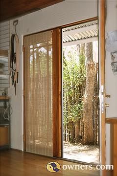 3rd bedroom/studio French doors courtyard