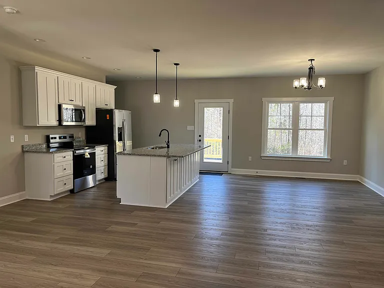 great room, kitchen, dining. island is ready for stools