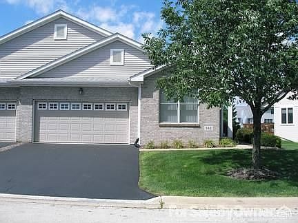 Front of Condo : Yard and driveway maintained by the association. Customize with flowers and pots