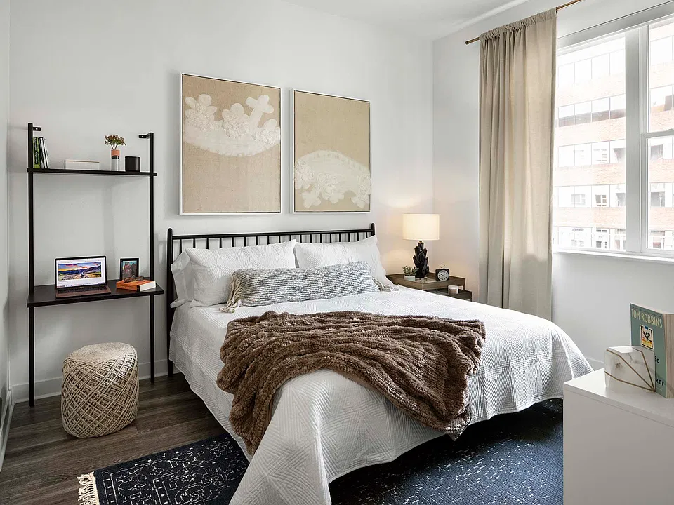 Griffis Cherry Creek North apartment bedroom with wood style floor.