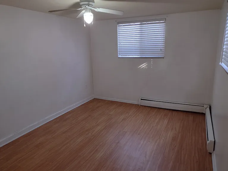 1st Large Bedroom with 2 windows and a closet