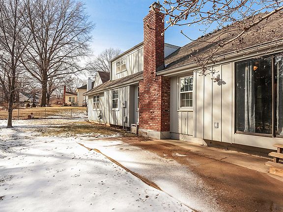 Rear of home with large deck for extra space. Fenced Yard!