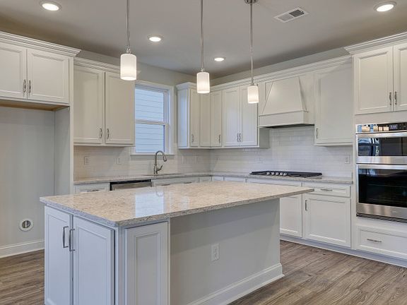 Spacious Gourmet Kitchen area with a large island.