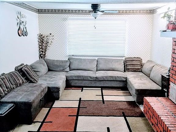 Huge Family Room with Wood Burning Fireplace.