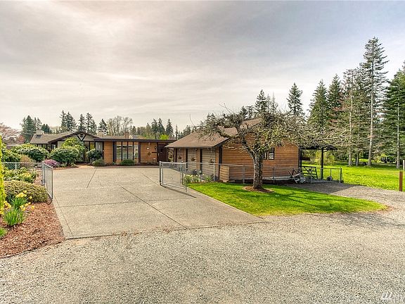 Fully fenced corner property. Gate at driveway and at RV carport on the right side of garage.