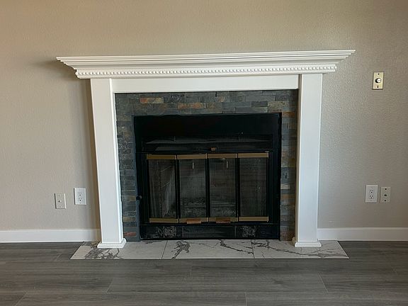 Main Floor living room 12' x 21' with real wood burning fireplace