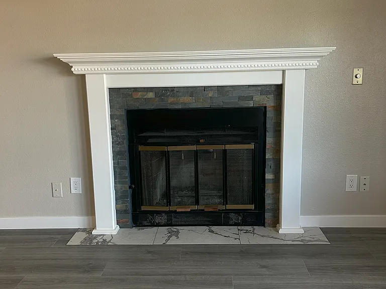 Main Floor living room 12' x 21' with real wood burning fireplace