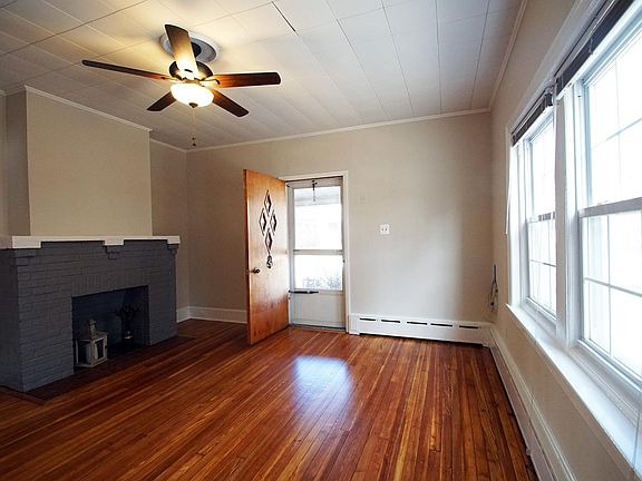 Living Room and Front Door to Covered Porch