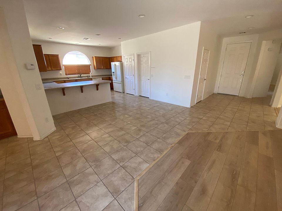 Entry way flows into kitchen and living area