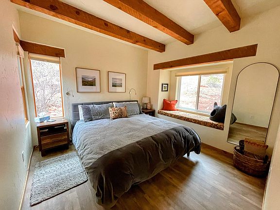 Primary bedroom with 3 windows.