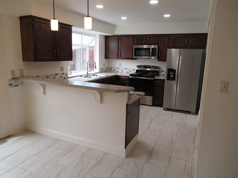 new kitchen applicances, counters, lighting