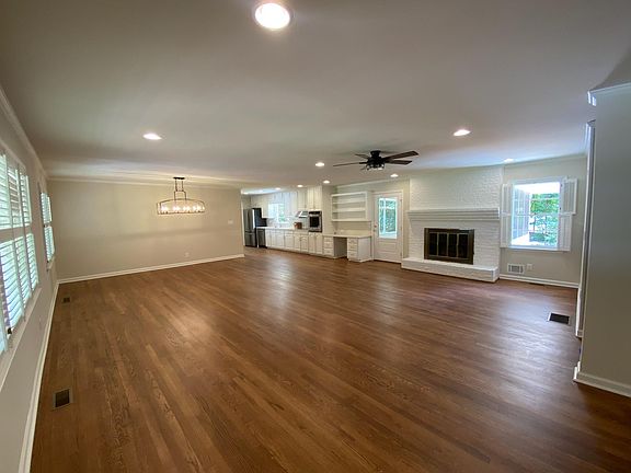 Open Floor Plan of Kitchen, Breakfast area, and sitting area with wood burning fireplace