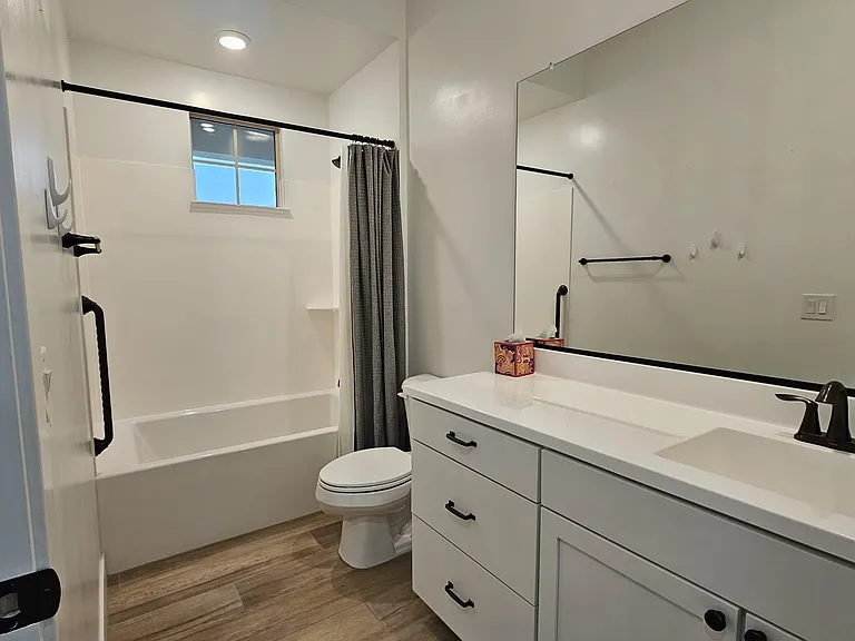 Guest bathroom with accessible grab bars