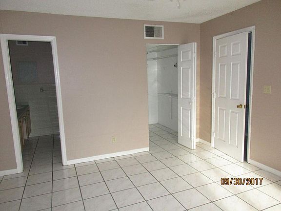 MBR- Walk-in closet and entrance to private master bathroom.