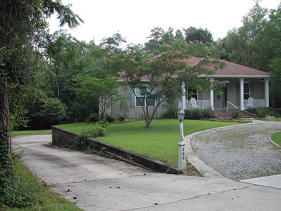 Concrete drive & large apron
						:
						Four car garage, work rooms w/benches & tables. Ample storage shelfs