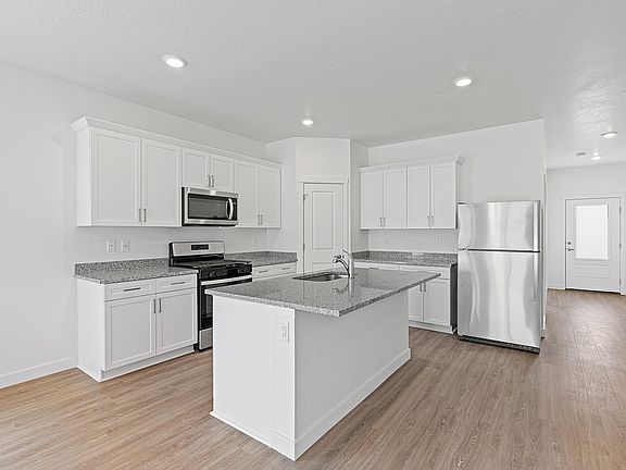 This kitchen is chef-ready with stainless-steel appliances