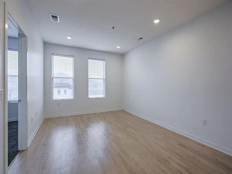 Natural lighting coming in from two windows in a unit at The Rise.