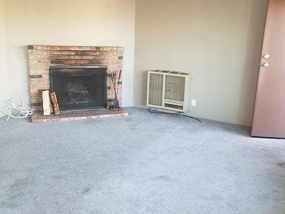 Living room with wood burning fireplace