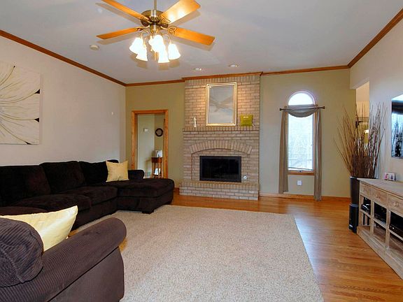 Great Room with Hrd Flooring, Volume Ceilings & a "Real" Wood Burning Fireplace.