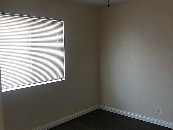 Bedroom #4 with window looking into backyard