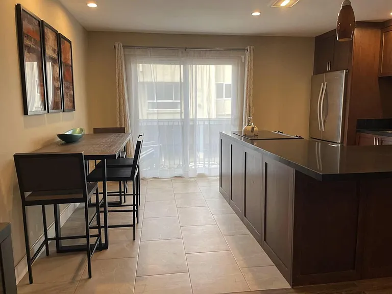 View through kitchen / dining area to balcony