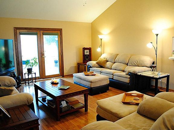The family room is spacious with glass doors leading to the back patio.