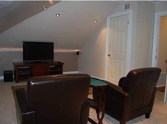 Media Room with dimmer lights and perimeter lighting