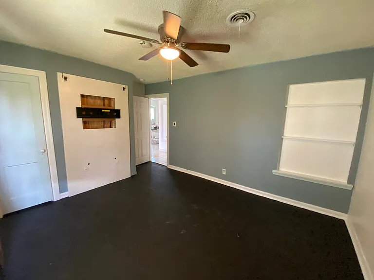 Second bedroom is spacious withceiling fan & TV wall mount already in place.