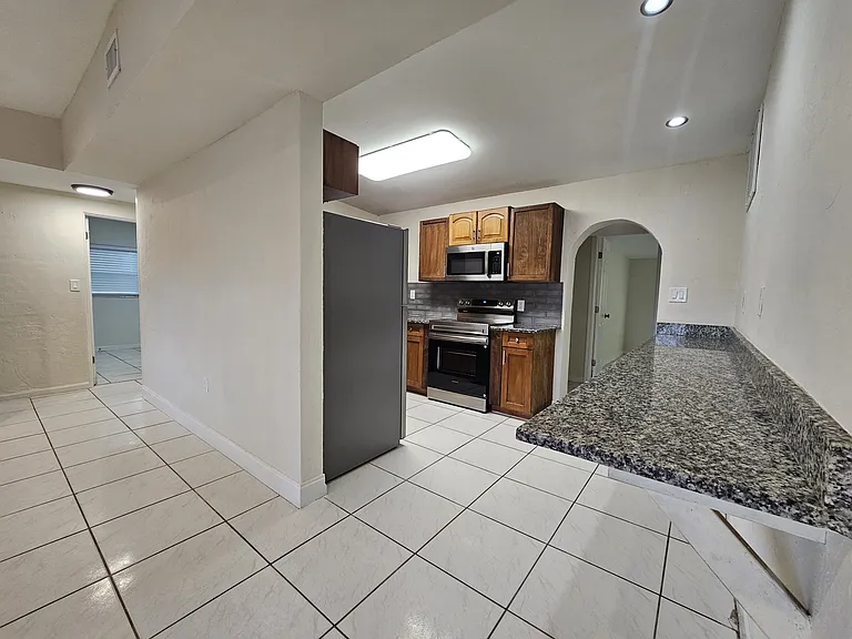 Kitchen with bar height dining counter