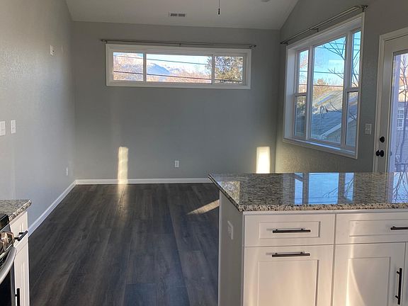 Durable floors and vaulted ceilings give this space a warm, modern feel.