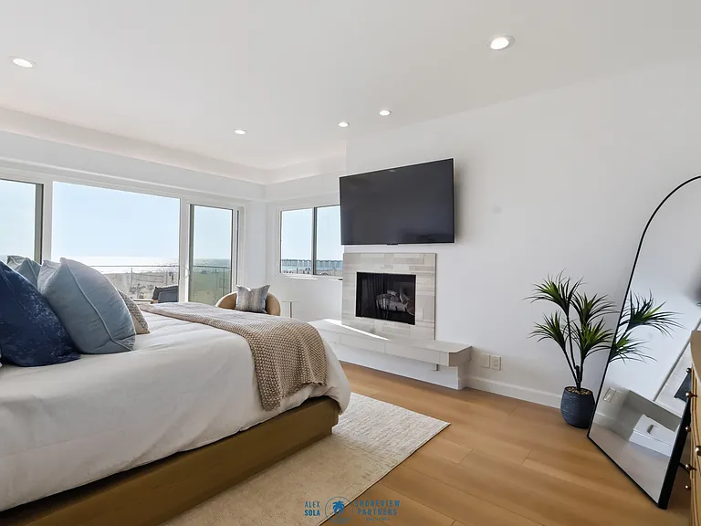 Primary bedroom features a covered balcony, fireplace, large spa bathroom, and incredibly spacious walk-in closet.