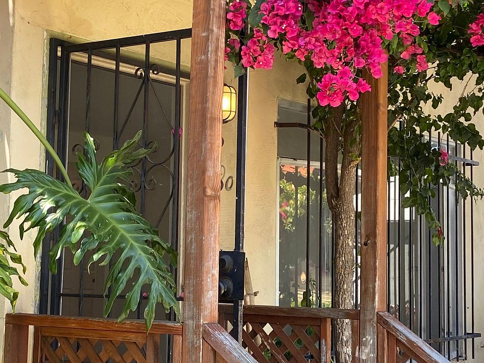 bougainvillea draped entrance gives a nice splash of everyday color