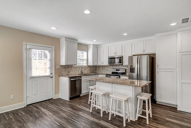 Kitchen/Living Area (laundry cabinet closed).
