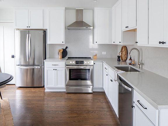 Gourmet eat-in kitchen with ample counter space, and additional pantry.