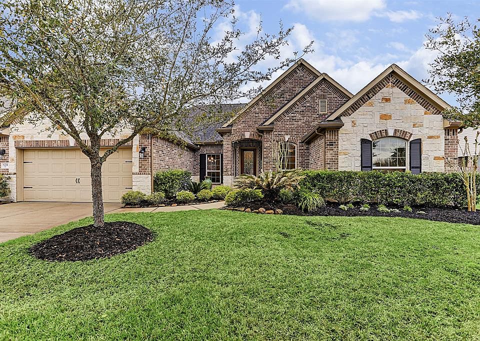 This beautiful one story home features a stunning brick and stone elevation.