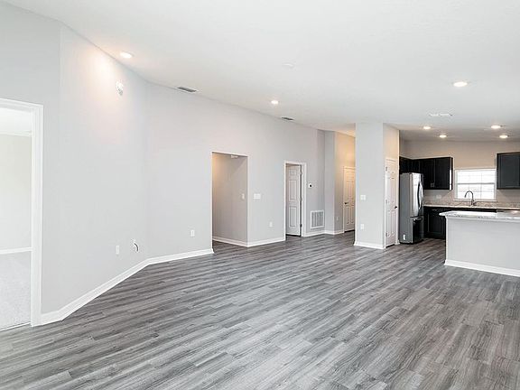 Your living area in finished with luxurious, low-maintenance wood vinyl plank flooring - New home fo