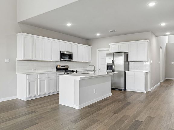 Kitchen in the Winters home plan by Trophy Signature Homes - REPRESENTATIVE PHOTO